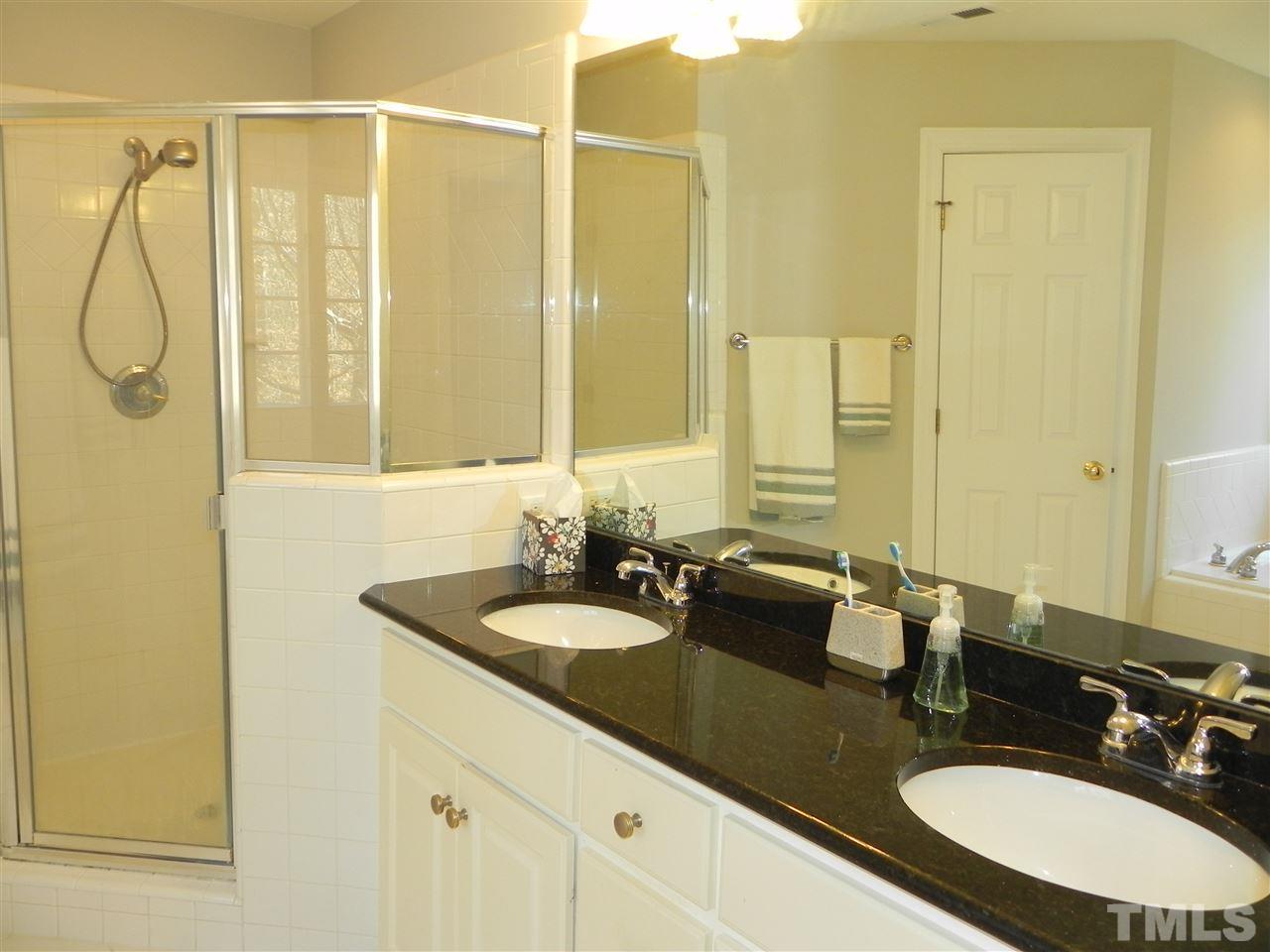 5505 Overleaf Court Raleigh, NC 27615 - Photo 12 of 25 Granite Countertop Dual Vanity with Separate Tile Shower, Whirlpool Soaking Tub & Private Loo