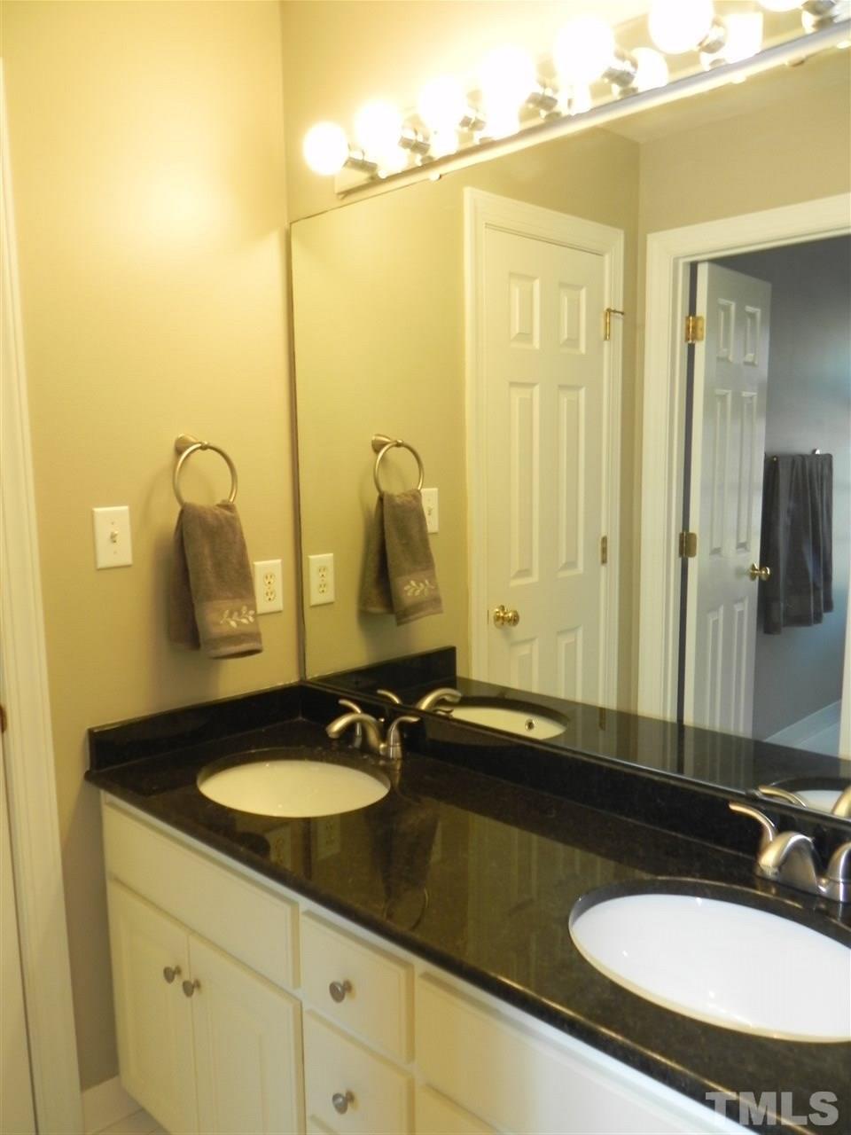 5505 Overleaf Court Raleigh, NC 27615 - Photo 16 of 25 Full Bathroom w/Granite Countertop Dual Vanity and Separate Room for Tub/Shower Combo and Loo