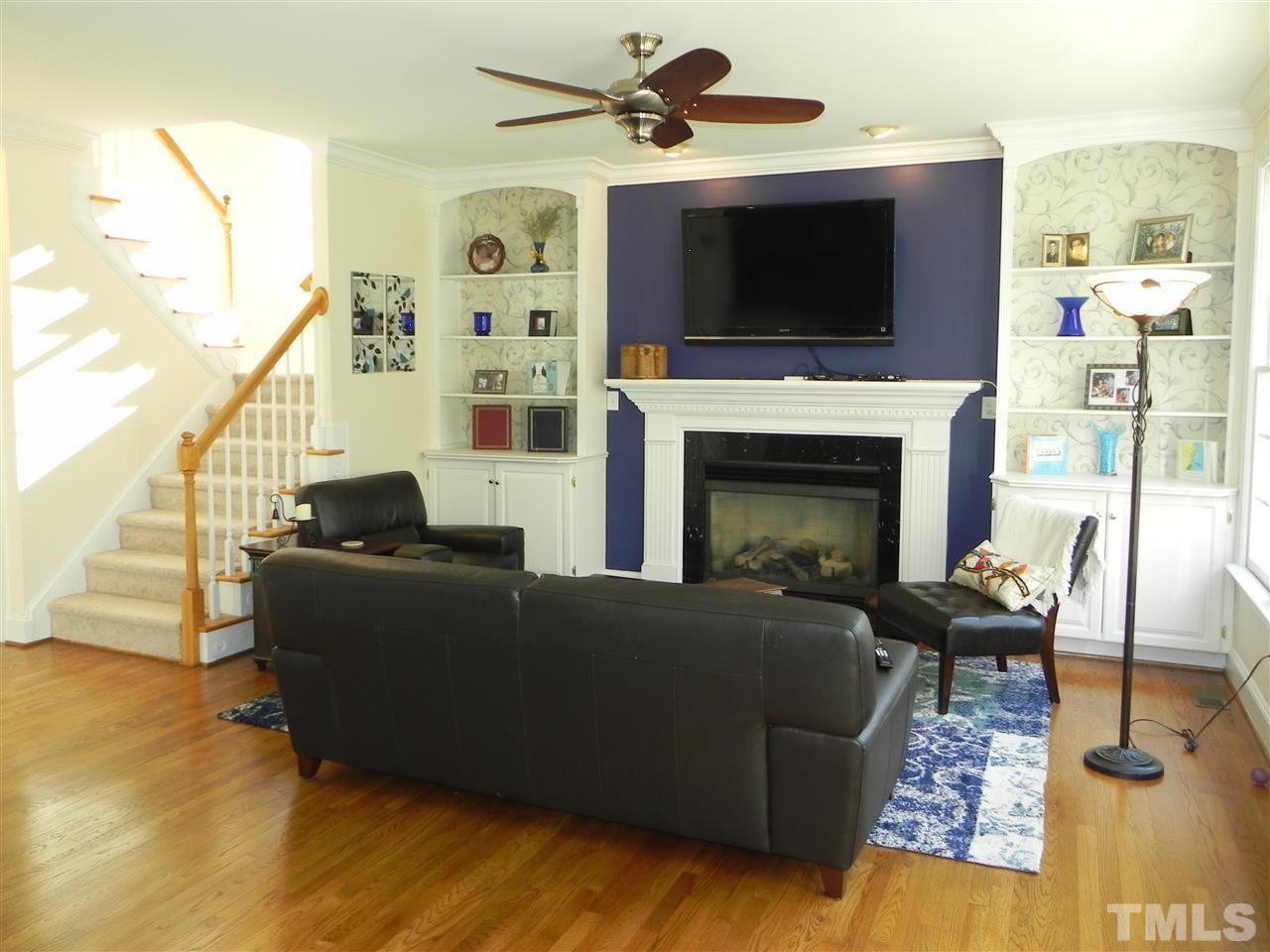 5505 Overleaf Court Raleigh, NC 27615 - Photo 6 of 25 Large Picture Windows, Built-Ins and a Cozy Fireplace Make This Room Wonderful for Gatherings