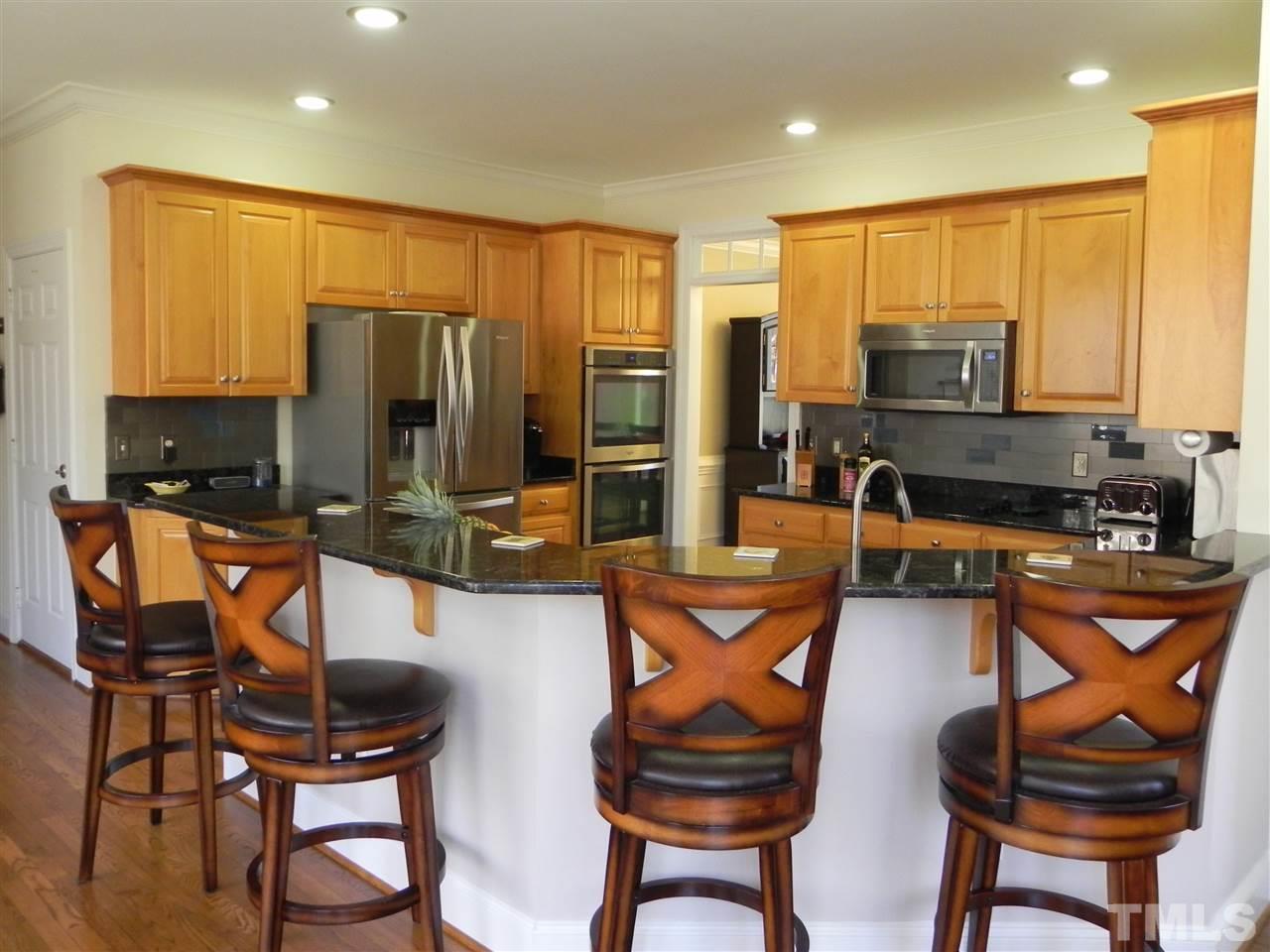5505 Overleaf Court Raleigh, NC 27615 - Photo 7 of 25 What a Great Kitchen! Large Breakfast Bar w/Granite Countertops Isn't Always Easy to Find