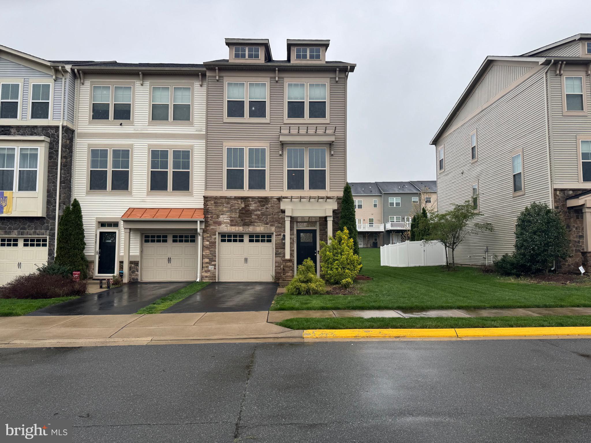 a house view with swimming pool and garden space