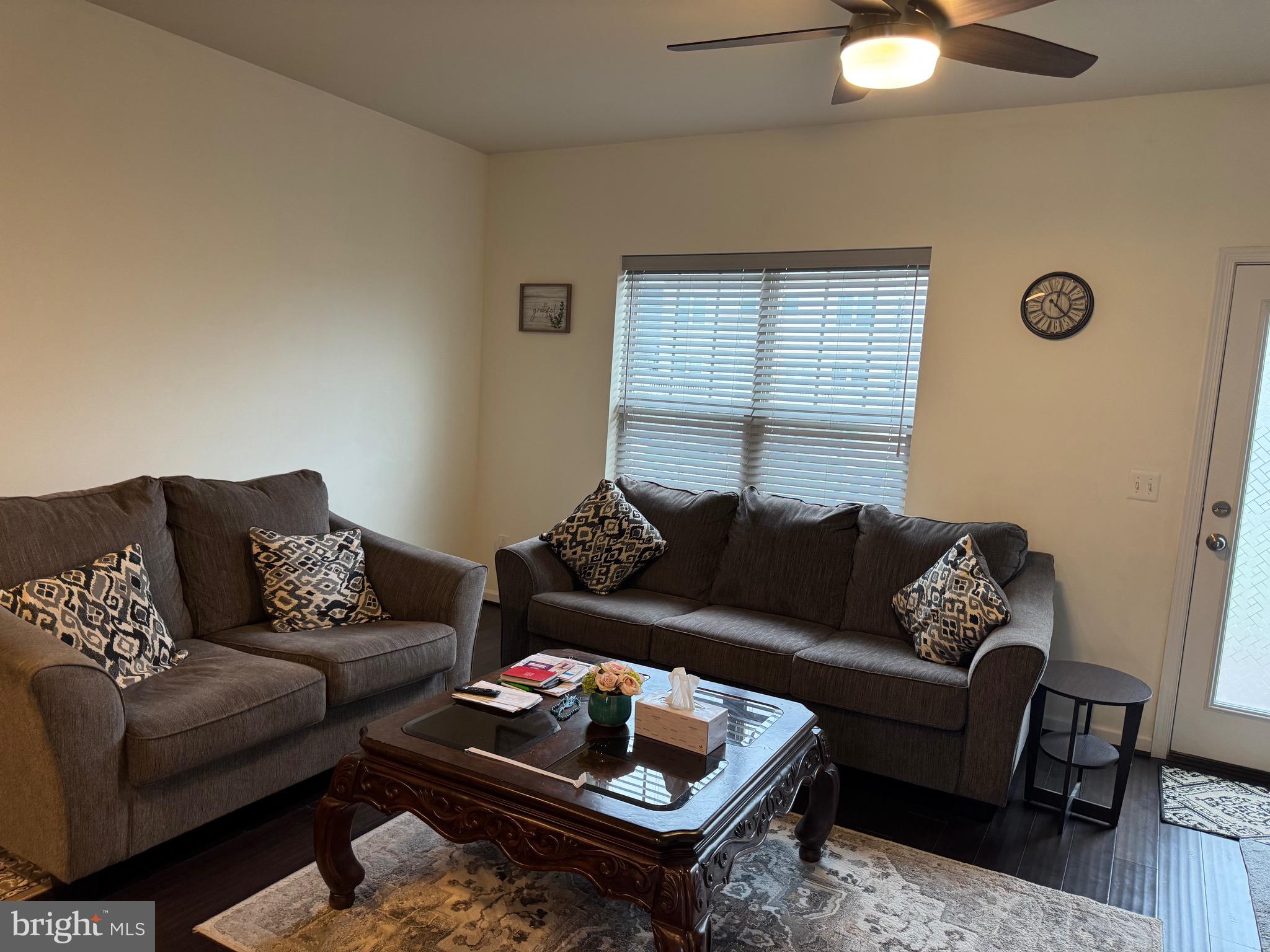 8937 Garrett Way Manassas, VA 20112 - Photo 17 of 66 a living room with furniture and a couch