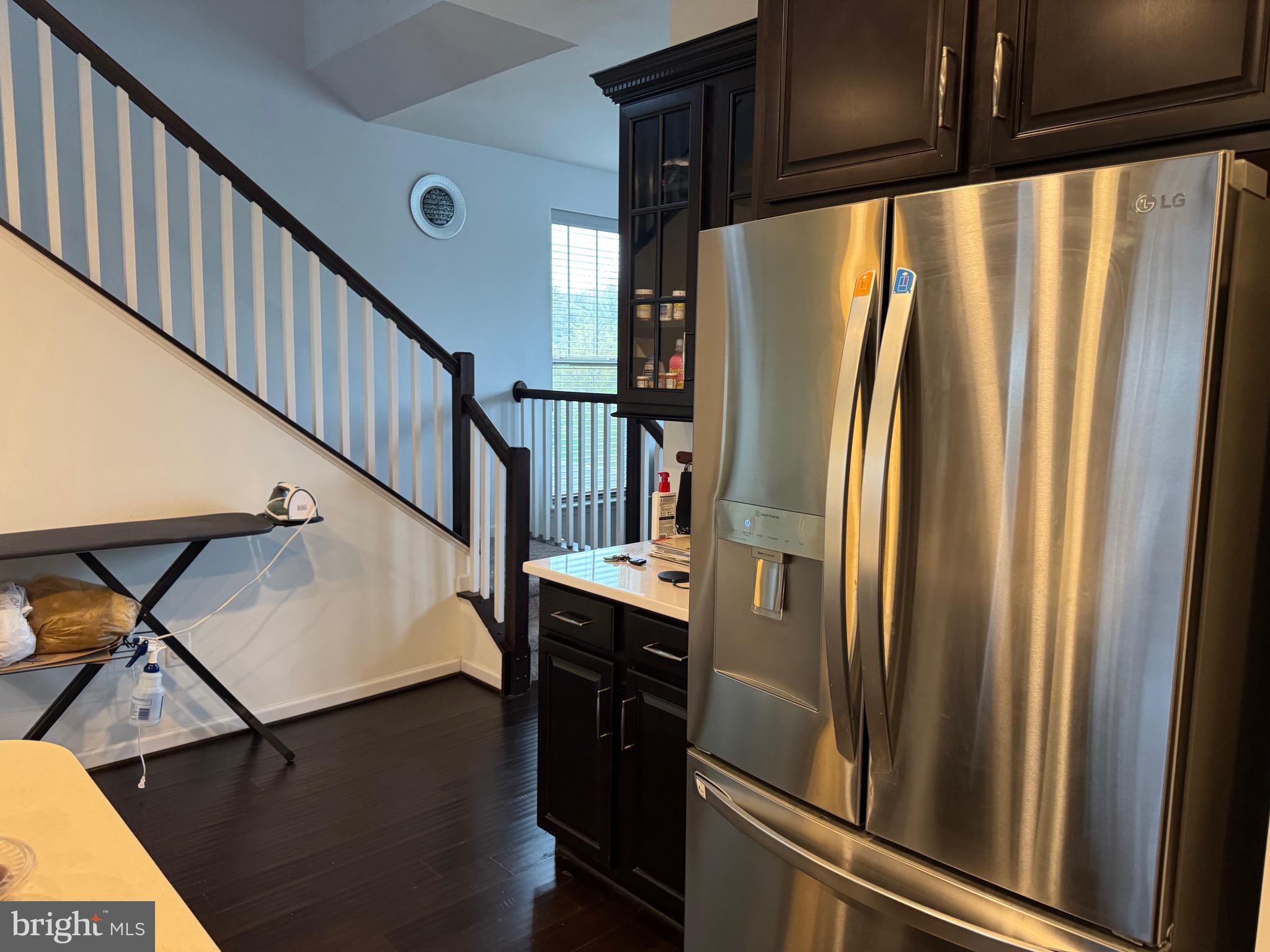 8937 Garrett Way Manassas, VA 20112 - Photo 20 of 66 a view of a kitchen with a refrigerator