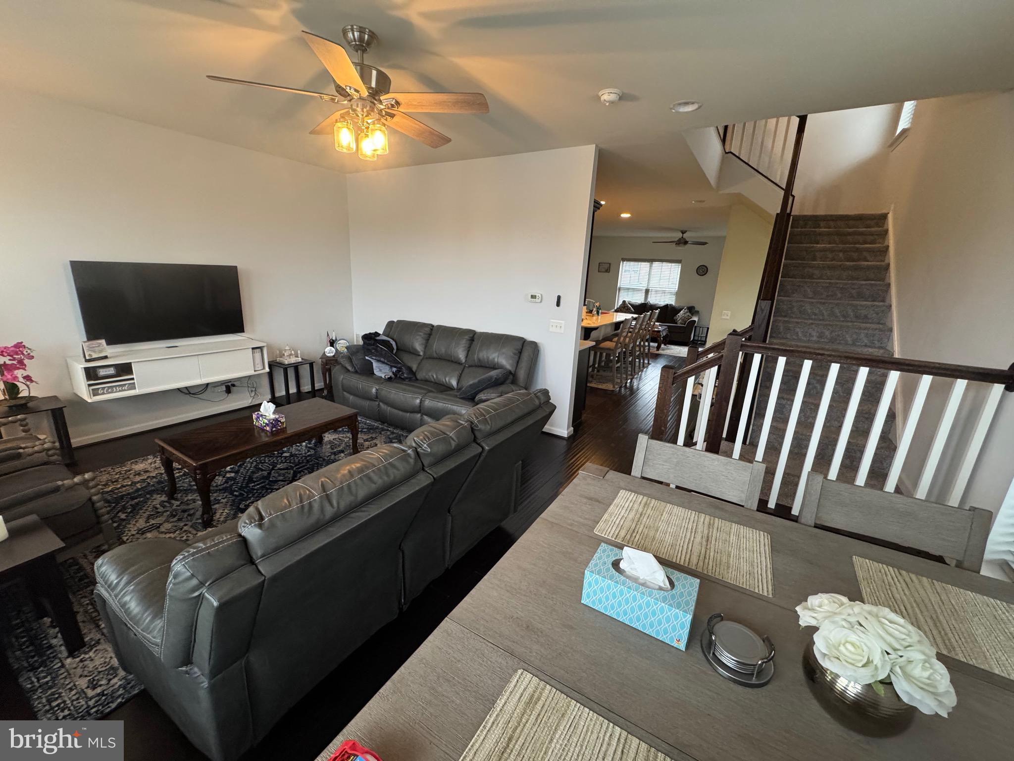 8937 Garrett Way Manassas, VA 20112 - Photo 24 of 66 a living room with furniture and a flat screen tv