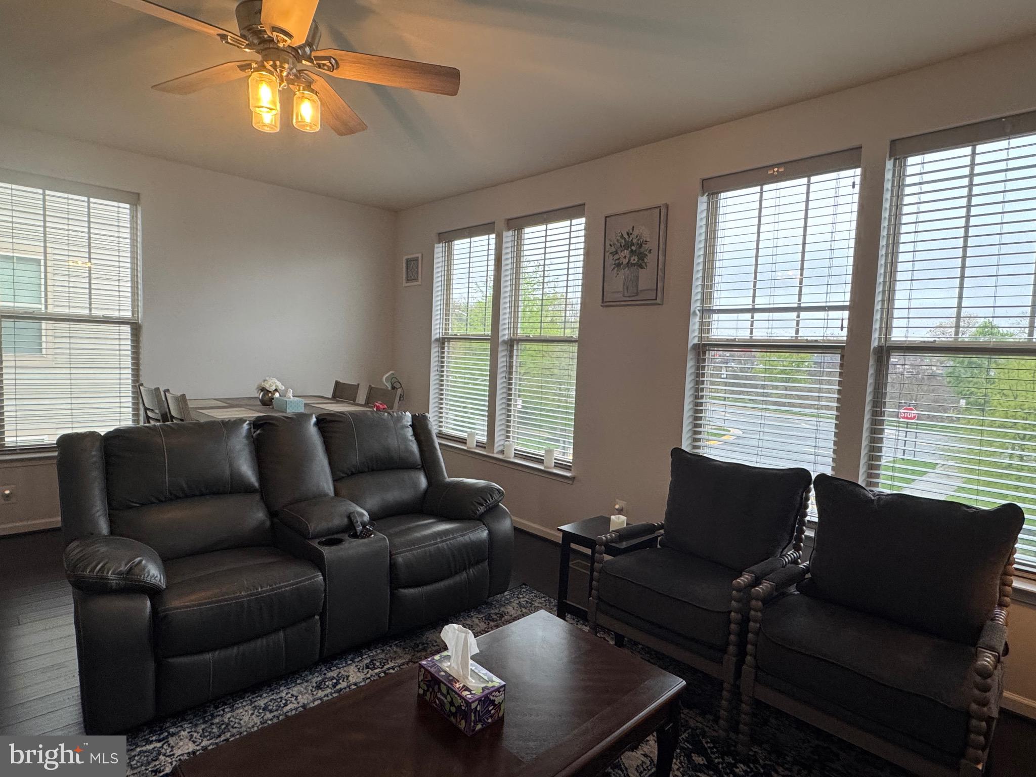 8937 Garrett Way Manassas, VA 20112 - Photo 26 of 66 a living room with furniture and a large window