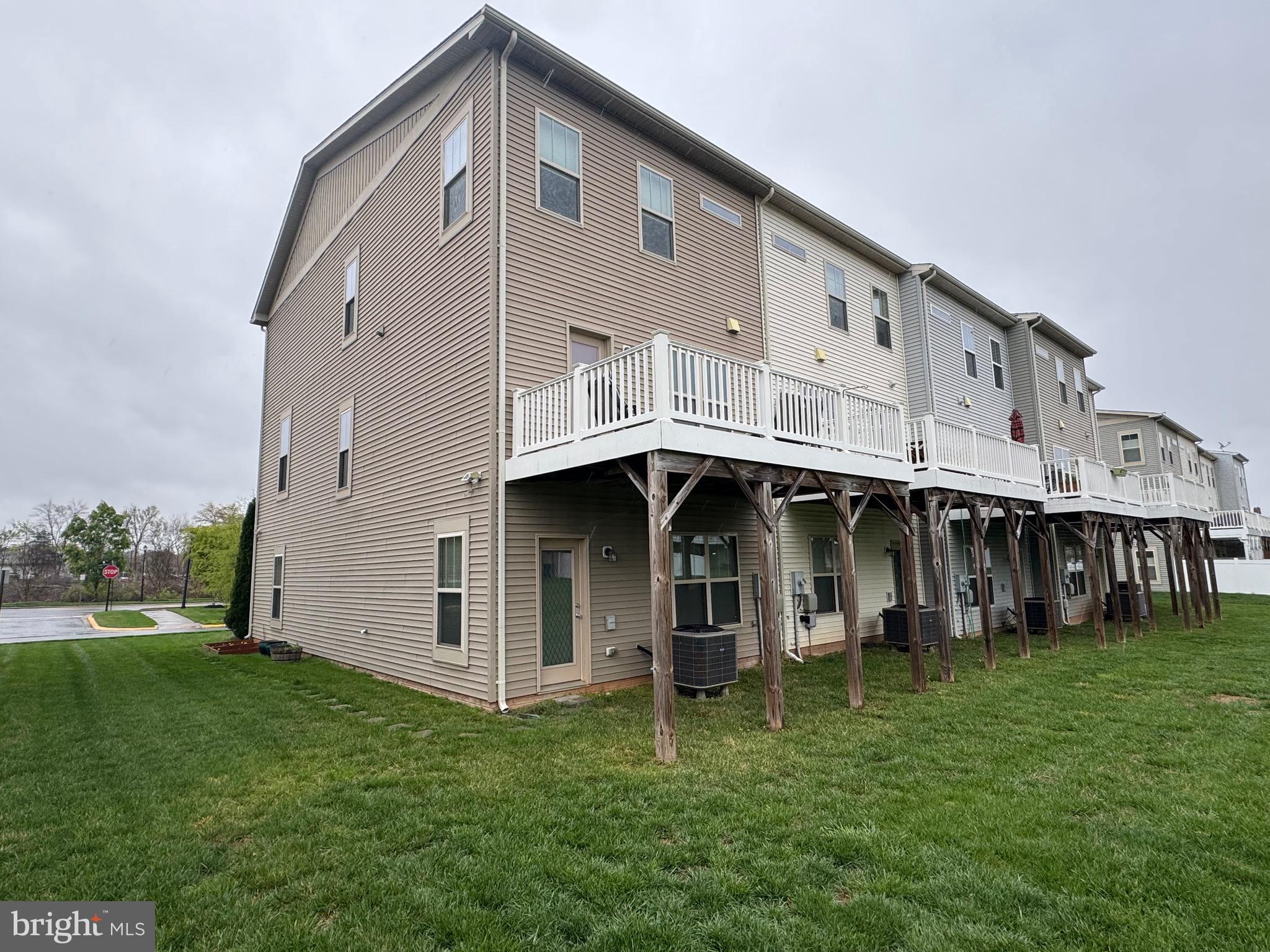 8937 Garrett Way Manassas, VA 20112 - Photo 3 of 66 a view of a house with a yard