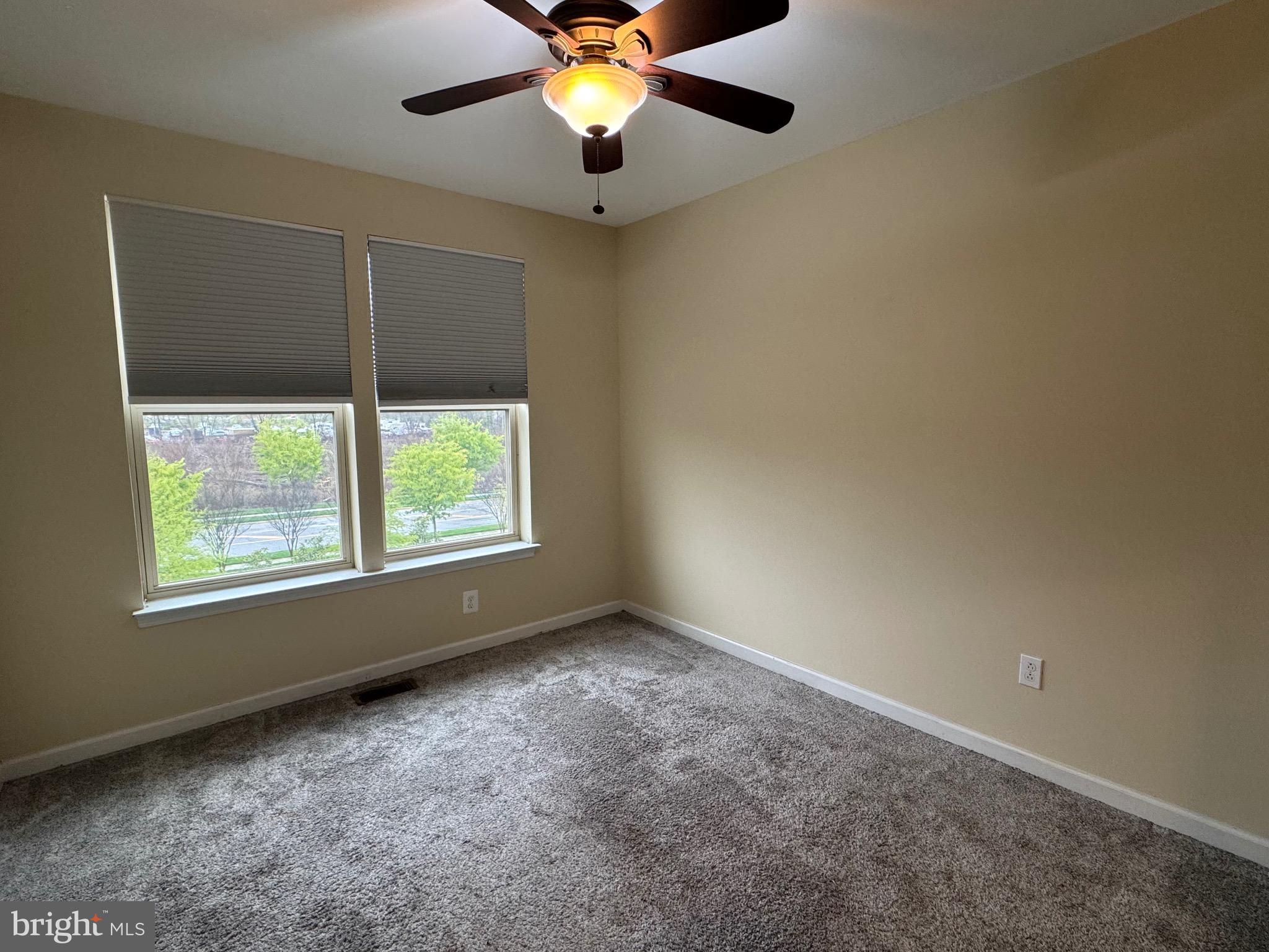 8937 Garrett Way Manassas, VA 20112 - Photo 33 of 66 an empty room with windows and fan
