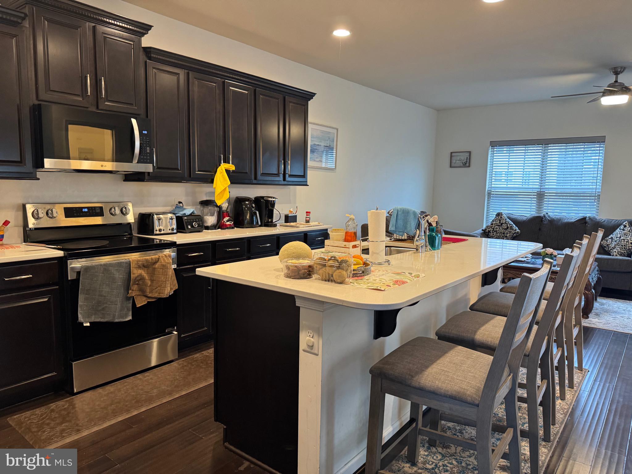 8937 Garrett Way Manassas, VA 20112 - Photo 5 of 66 a kitchen with a sink and cabinets
