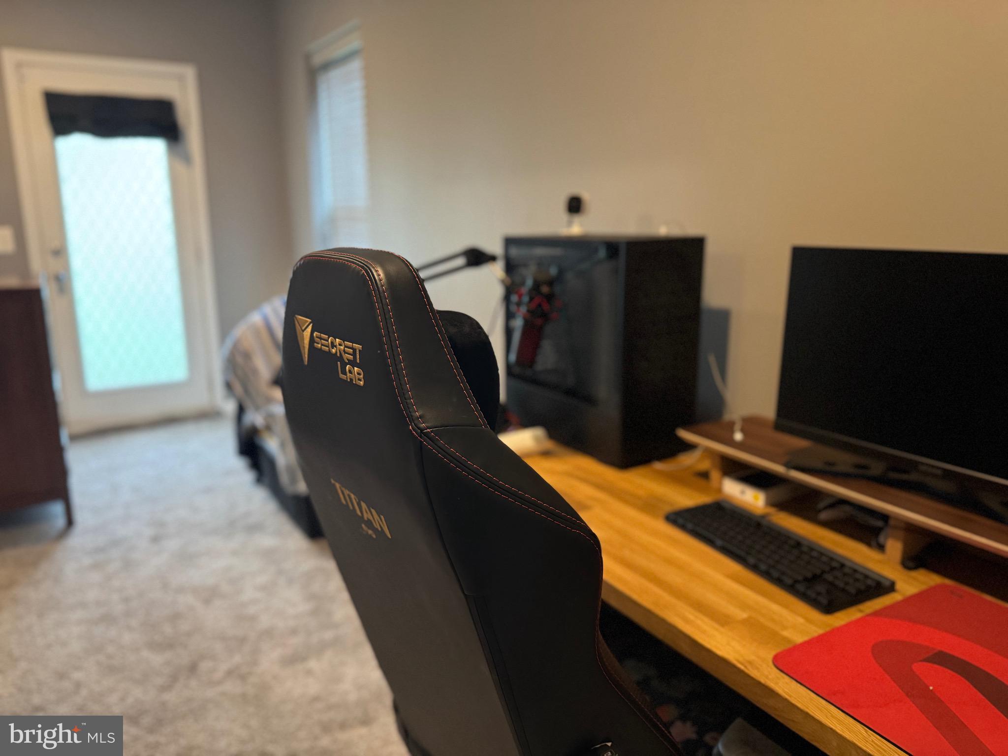 8937 Garrett Way Manassas, VA 20112 - Photo 56 of 66 a bedroom with furniture and flat screen tv