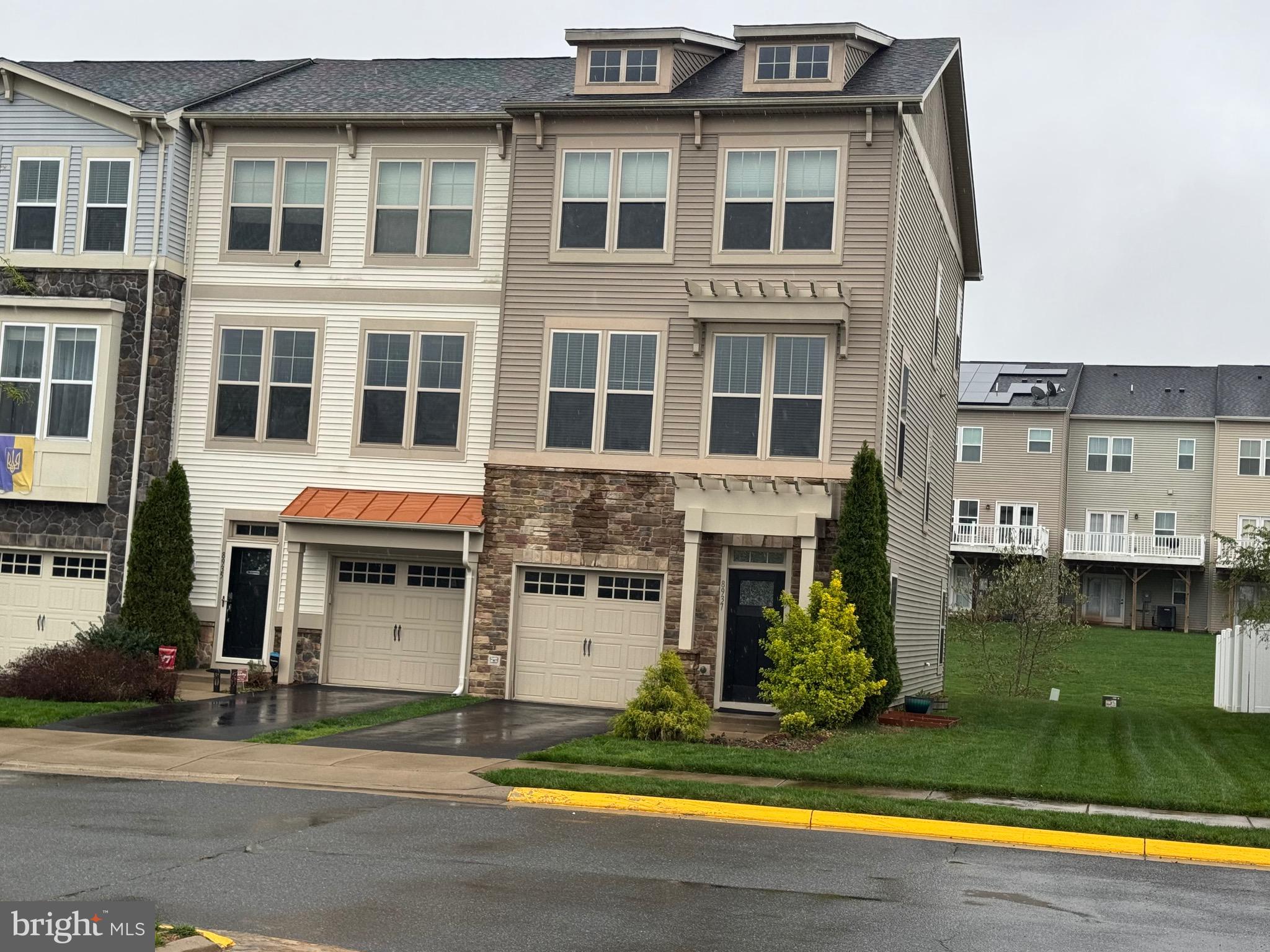 8937 Garrett Way Manassas, VA 20112 - Photo 66 of 66 a view of a building with a swimming pool