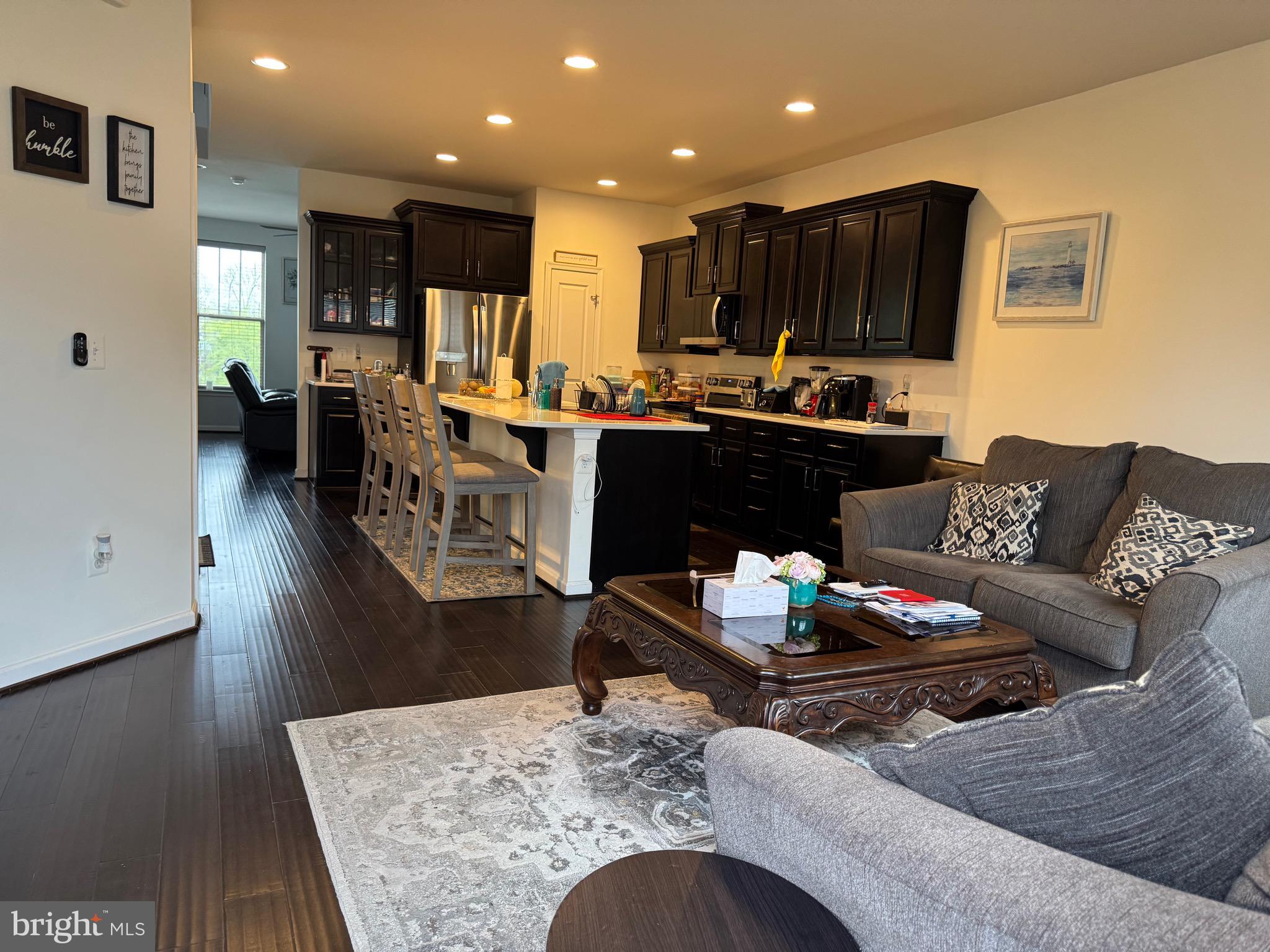 8937 Garrett Way Manassas, VA 20112 - Photo 10 of 66 a living room with furniture kitchen view and a table