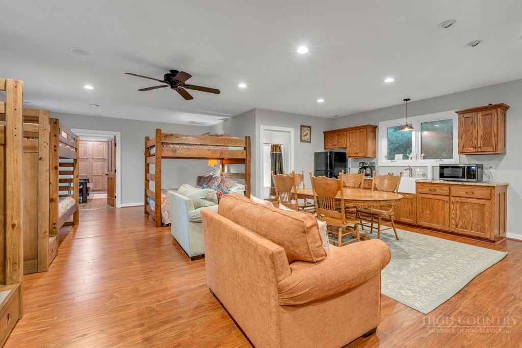 160 Outback Road Ferguson, NC 28624 - Photo 44 of 49 a living room with furniture and a wooden floor