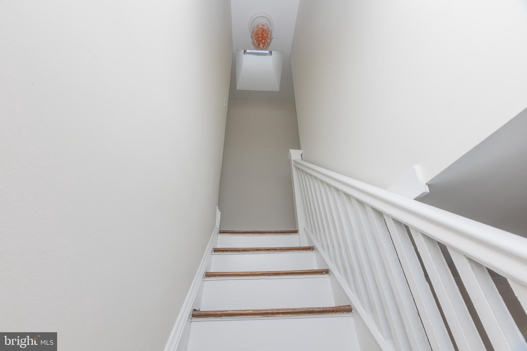 3659 Chestnut Avenue Baltimore, MD 21211 - Photo 9 of 20 Stairs to second level with skylight