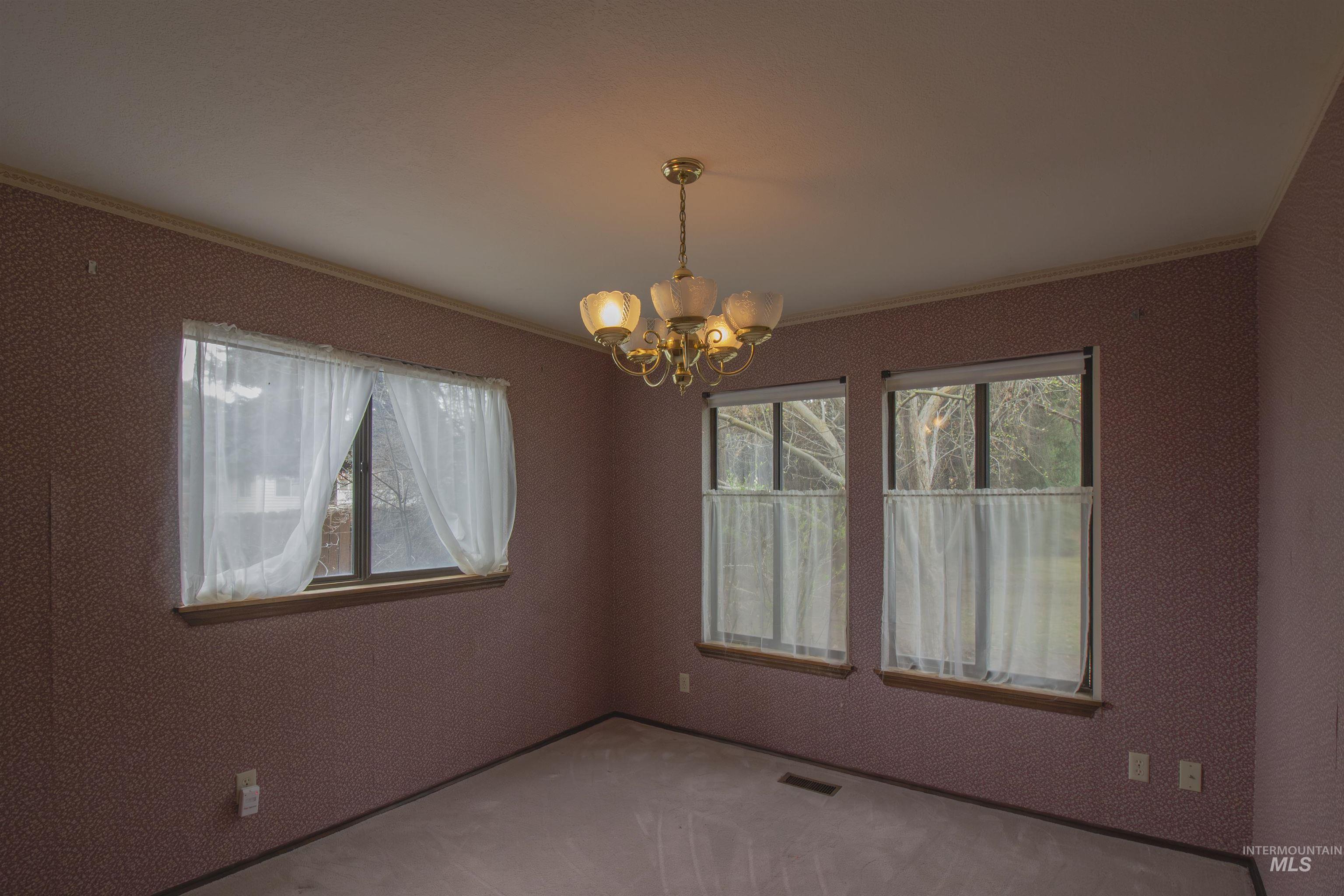 2465 Center Avenue Payette, ID 83661 - Photo 17 of 39 Bedroom featuring suspended lighting and crown molding