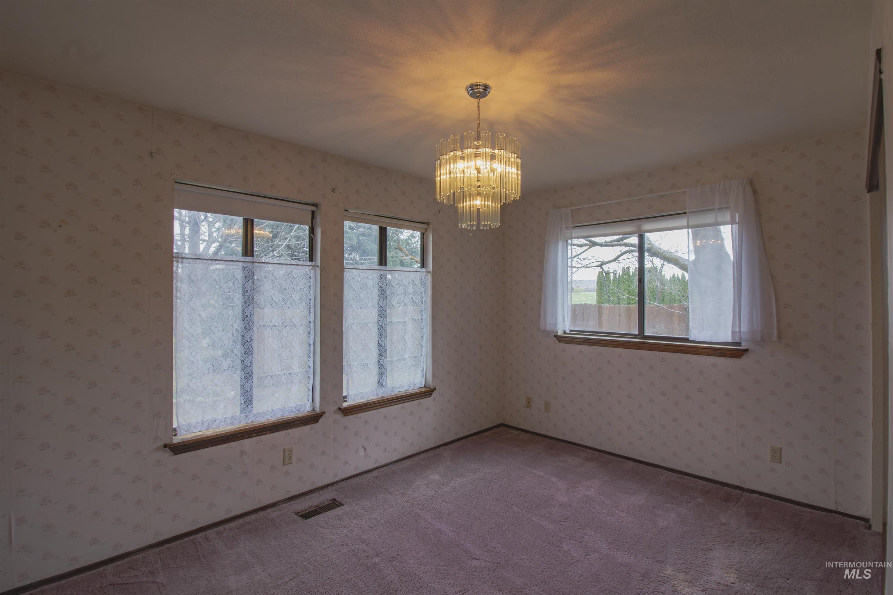 2465 Center Avenue Payette, ID 83661 - Photo 19 of 39 Bedroom featuring hanging lights