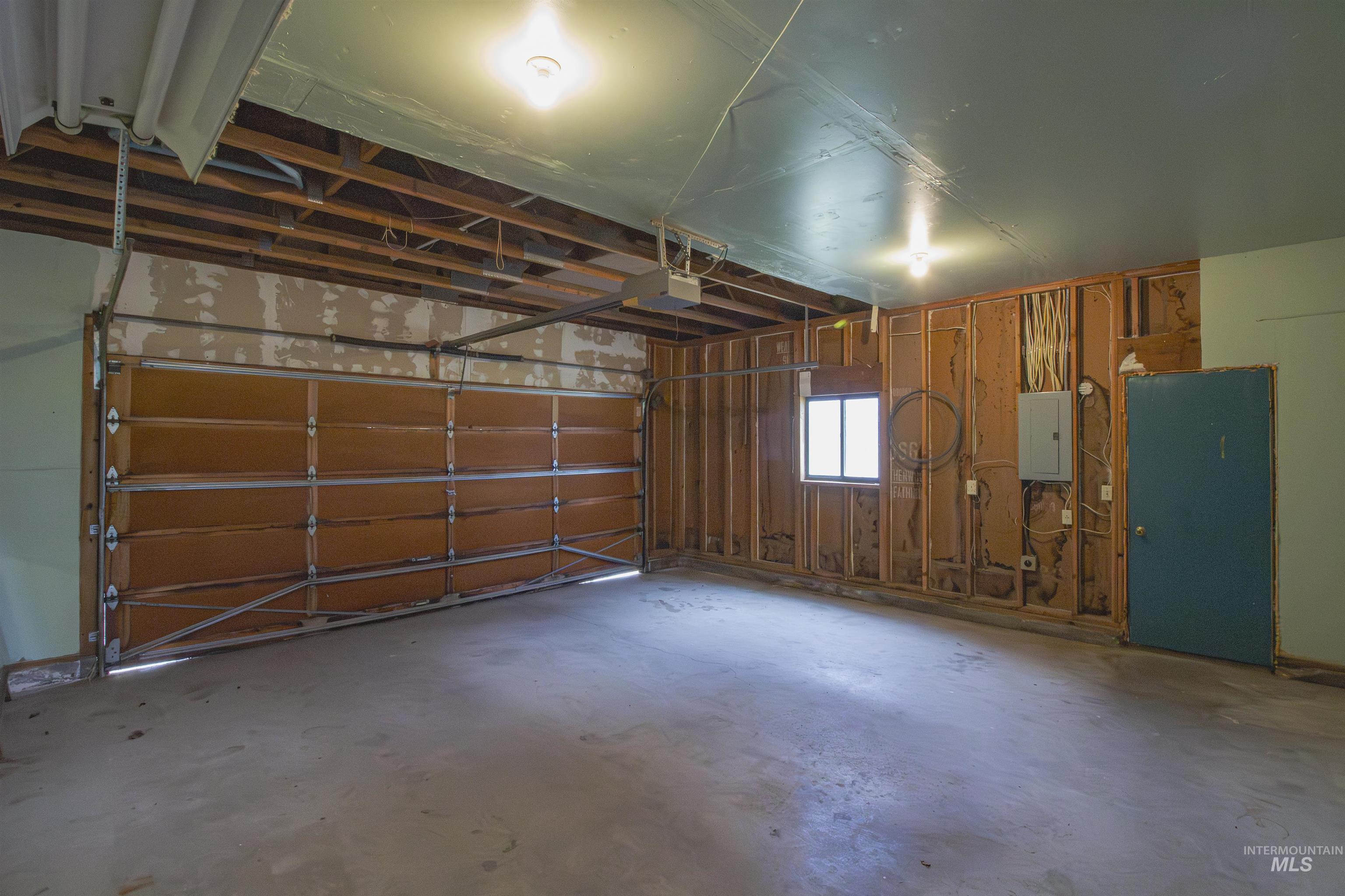 2465 Center Avenue Payette, ID 83661 - Photo 22 of 39 Garage featuring electric panel and a garage door opener