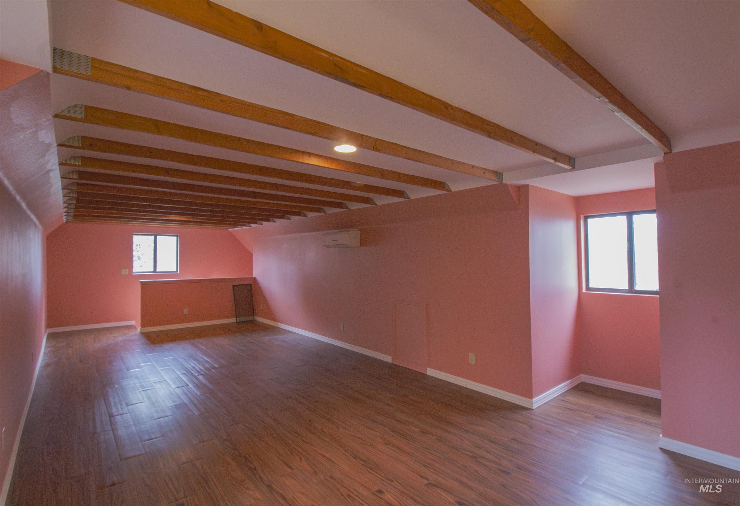 2465 Center Avenue Payette, ID 83661 - Photo 25 of 39 Family room featuring beamed ceiling and dark wood-type flooring