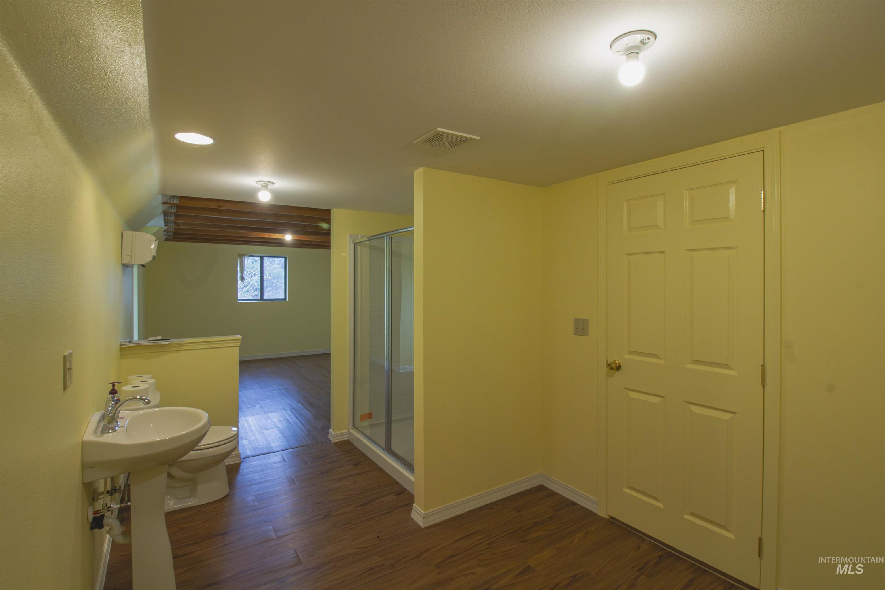 2465 Center Avenue Payette, ID 83661 - Photo 26 of 39 Upstairs bathroom with dark wood-style floors, recessed lighting and a stall shower
