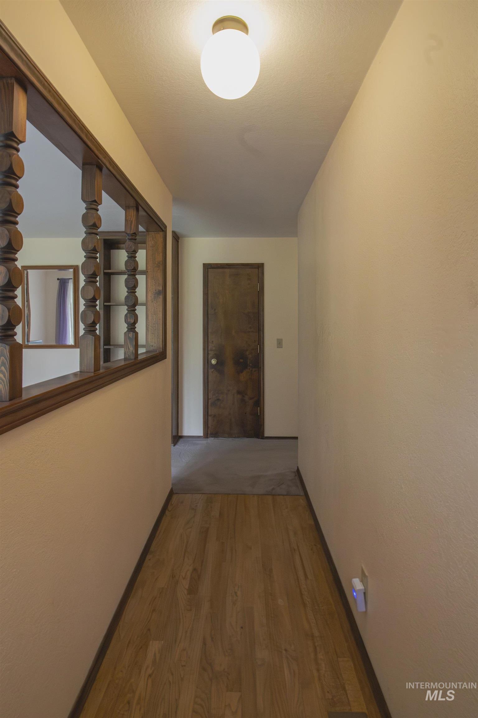 2465 Center Avenue Payette, ID 83661 - Photo 4 of 39 Corridor with light wood-type flooring and baseboards