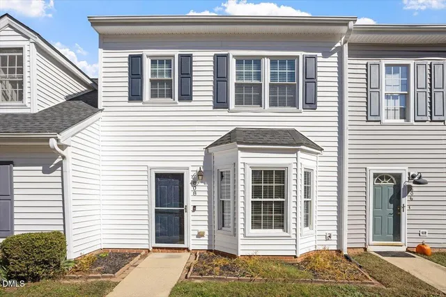 a view of a house with a door and a window