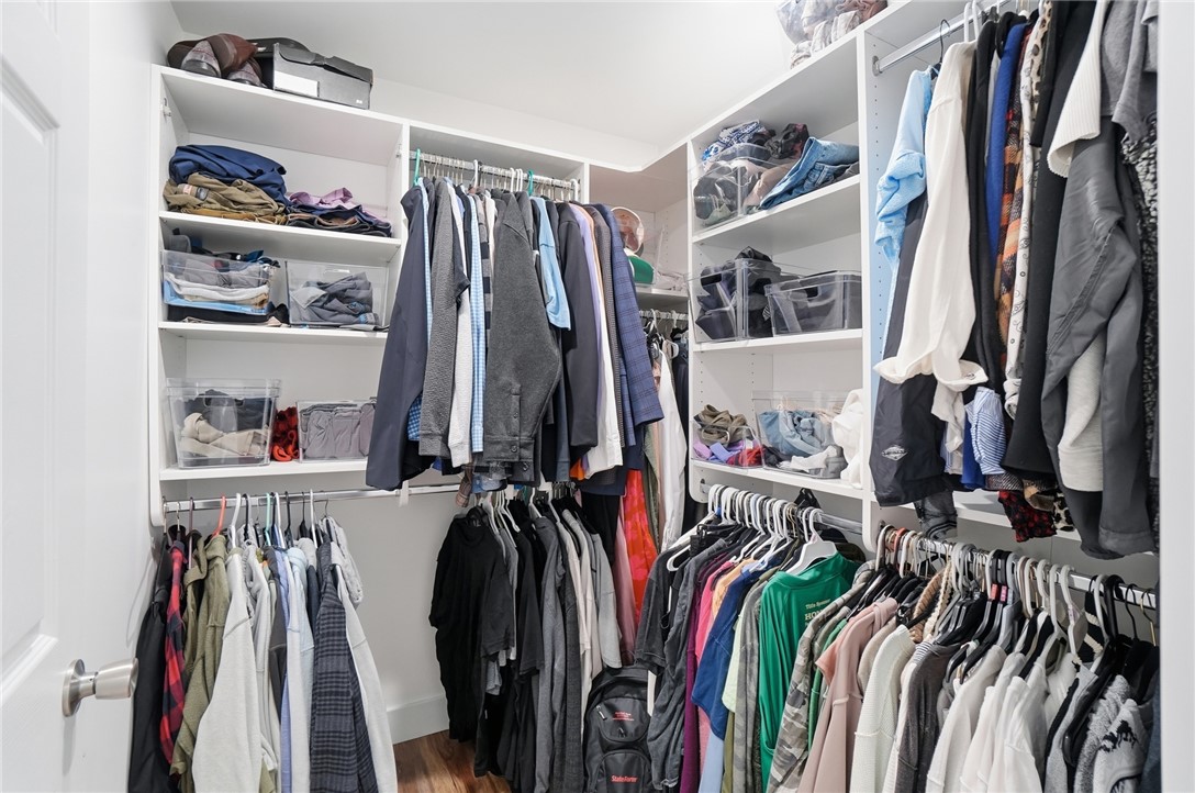 728 East Northern Avenue Springfield, OH 45503 - Photo 22 of 35 This spacious walk-in closet features ample storage with shelving and hanging rods for organized living.