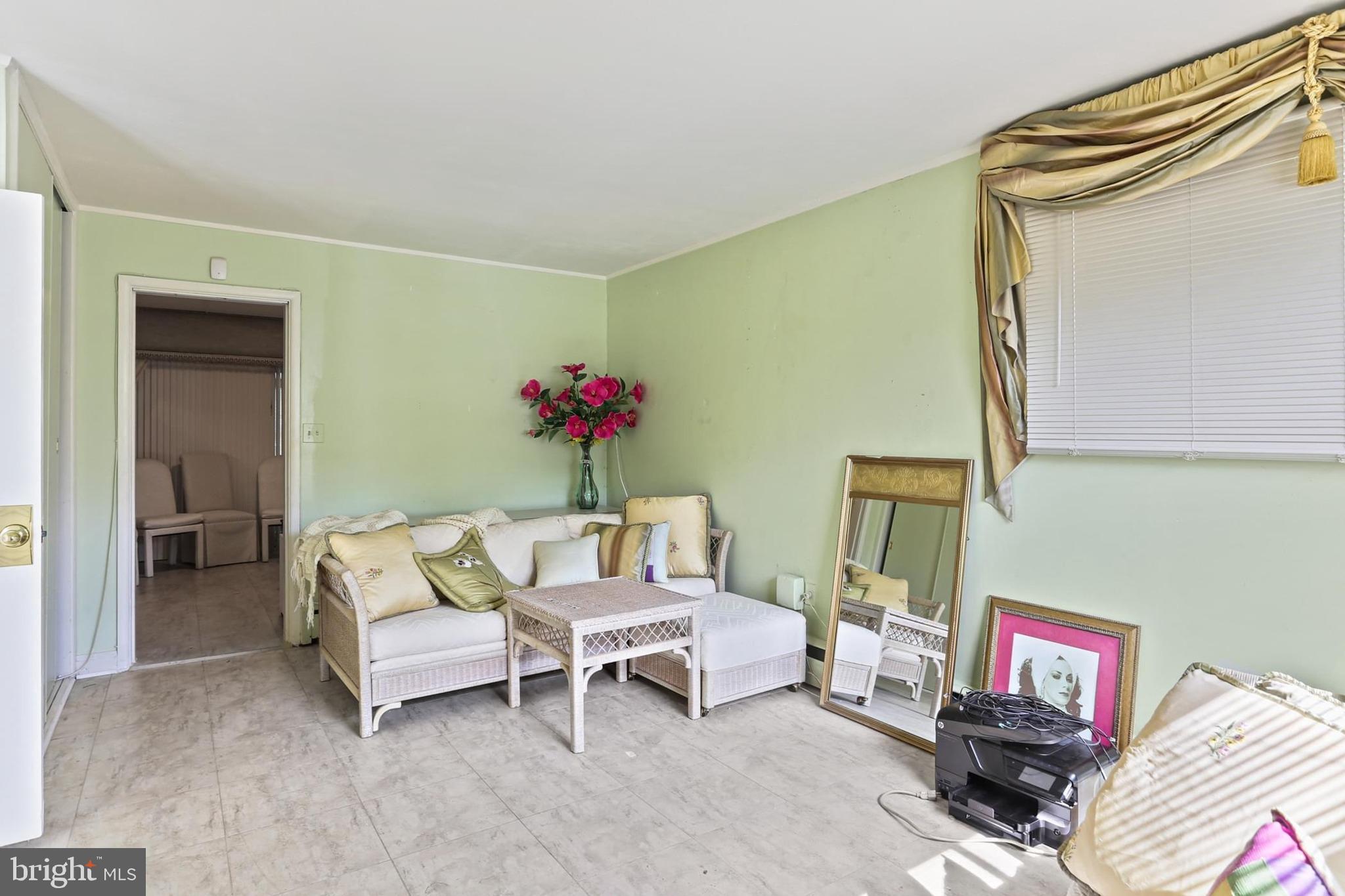7613 Carla Road Baltimore, MD 21208 - Photo 12 of 24 a living room with furniture and a wooden floor
