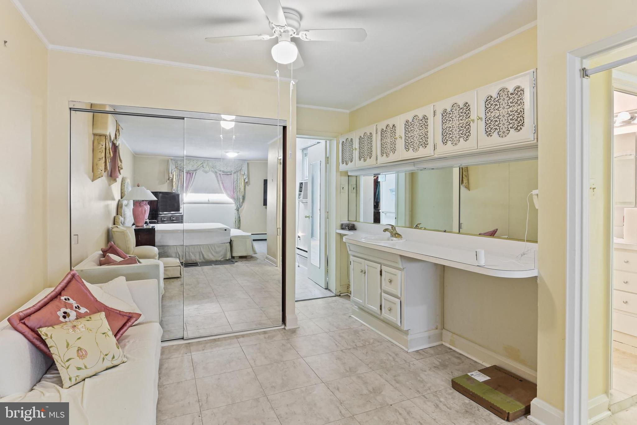 7613 Carla Road Baltimore, MD 21208 - Photo 13 of 24 a view of a bathroom sink and a mirror