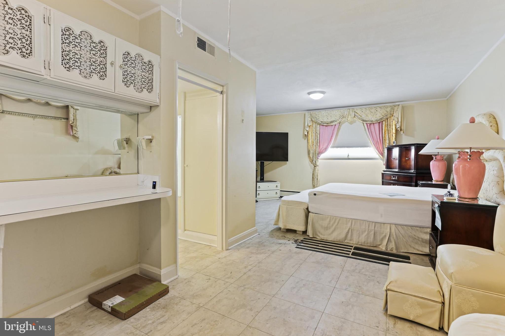 7613 Carla Road Baltimore, MD 21208 - Photo 19 of 24 a bed room with a bed and furniture