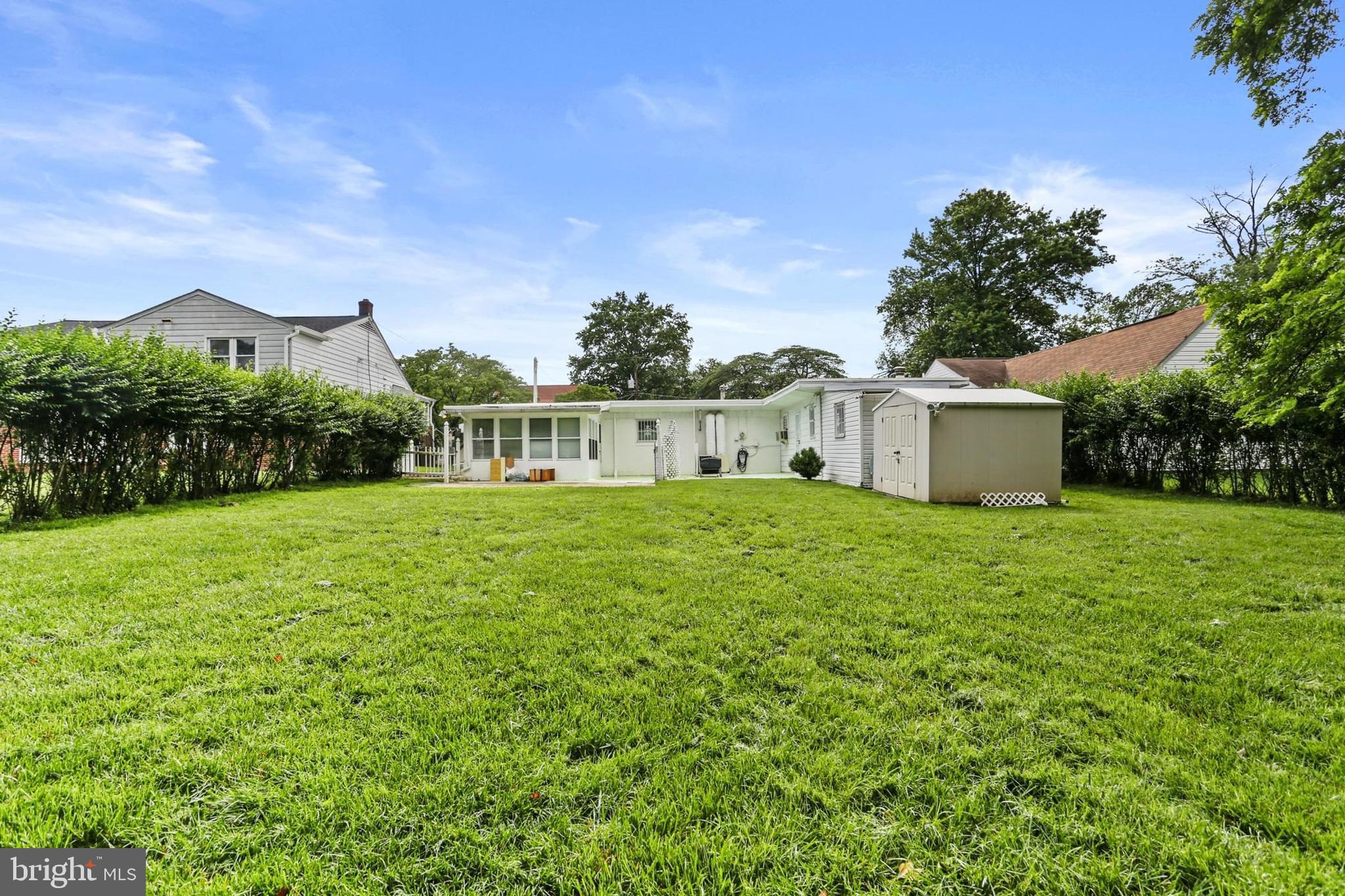 7613 Carla Road Baltimore, MD 21208 - Photo 22 of 24 a front view of a house with garden