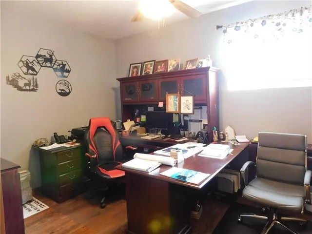 a dining room with a table and chairs