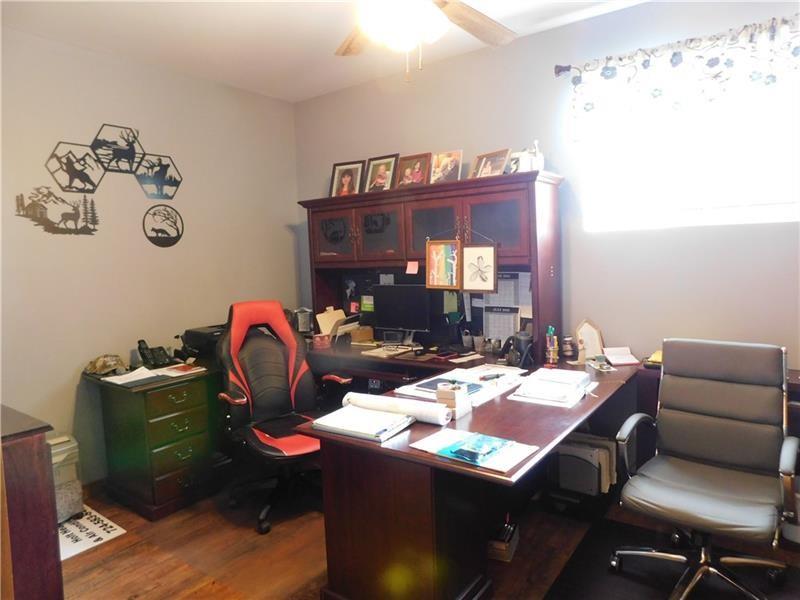 577 Woodside Old Frame Road Smithfield, PA 15478 - Photo 16 of 49 a dining room with a table and chairs