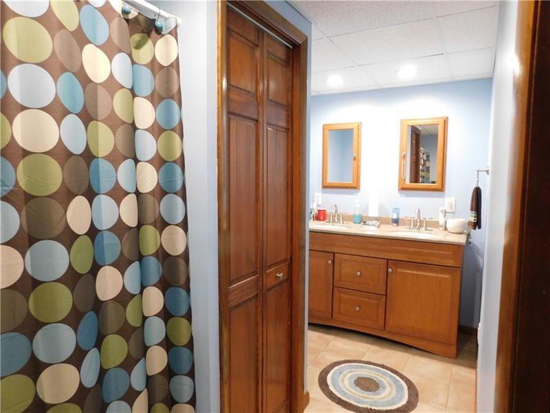 577 Woodside Old Frame Road Smithfield, PA 15478 - Photo 23 of 49 a bathroom with a granite countertop sink and a mirror