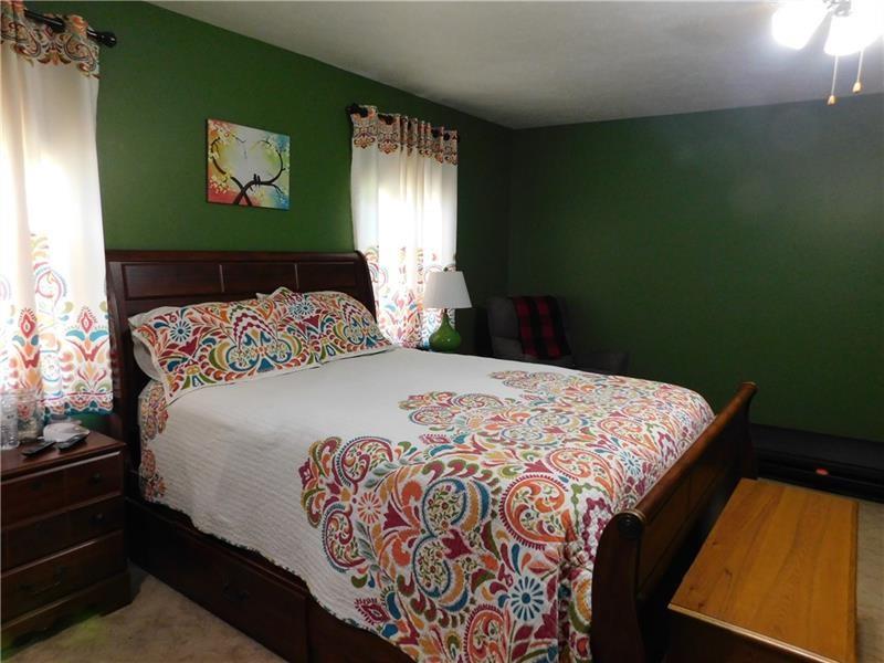 577 Woodside Old Frame Road Smithfield, PA 15478 - Photo 31 of 49 a bedroom with a bed and window