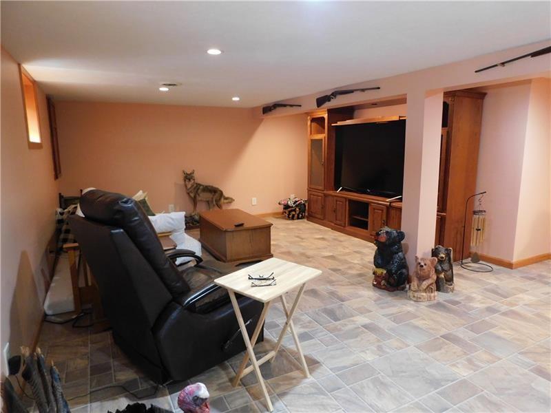 577 Woodside Old Frame Road Smithfield, PA 15478 - Photo 37 of 49 a living room with furniture and a flat screen tv