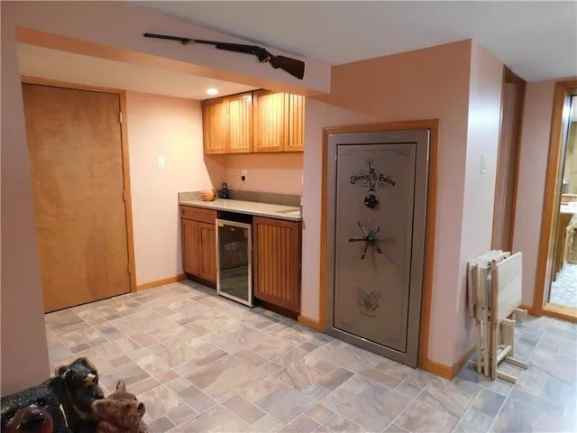 a view of a kitchen with a sink and cabinets