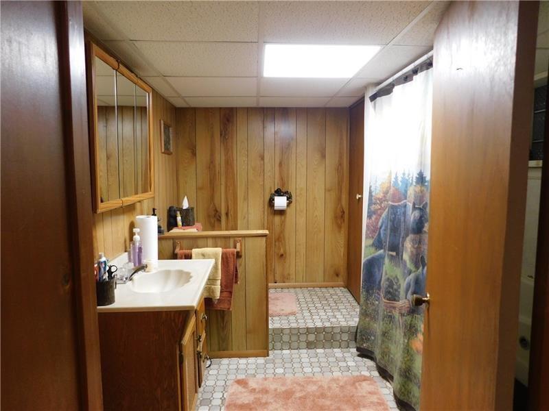 577 Woodside Old Frame Road Smithfield, PA 15478 - Photo 40 of 49 a bathroom with a sink a toilet and shower