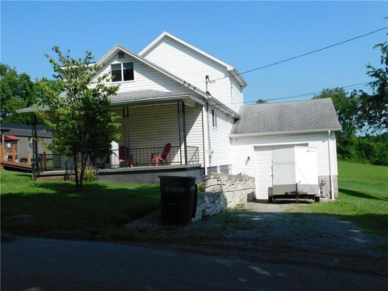 577 Woodside Old Frame Road Smithfield, PA 15478 - Photo 4 of 49 a view of a house with backyard and garden