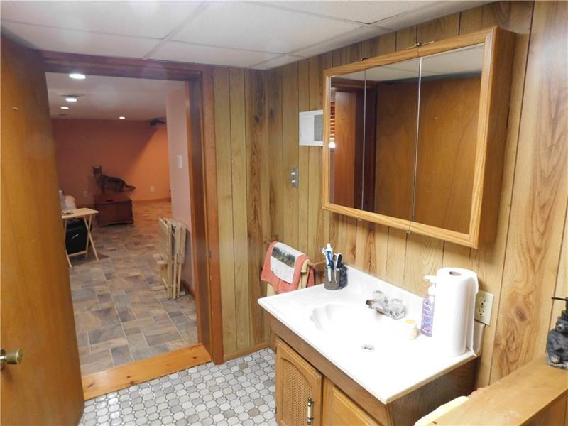 577 Woodside Old Frame Road Smithfield, PA 15478 - Photo 41 of 49 a bathroom with a sink a toilet and shower