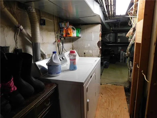 a kitchen with a sink appliances and cabinets