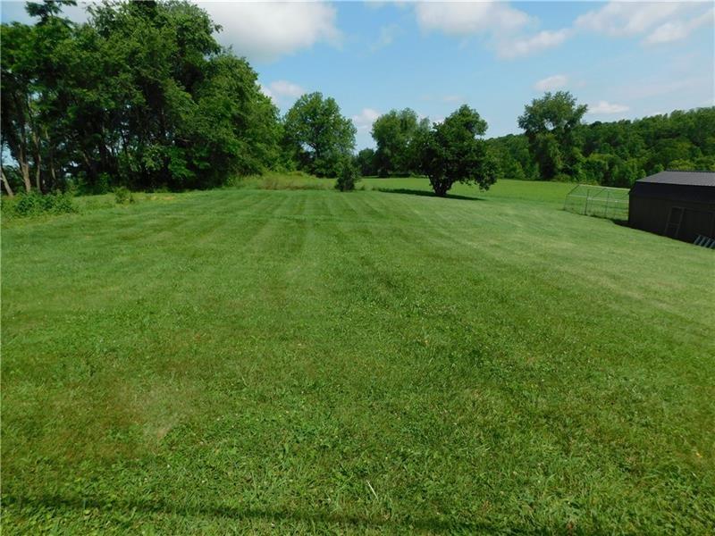 577 Woodside Old Frame Road Smithfield, PA 15478 - Photo 48 of 49 a view of grassy field with trees in the background