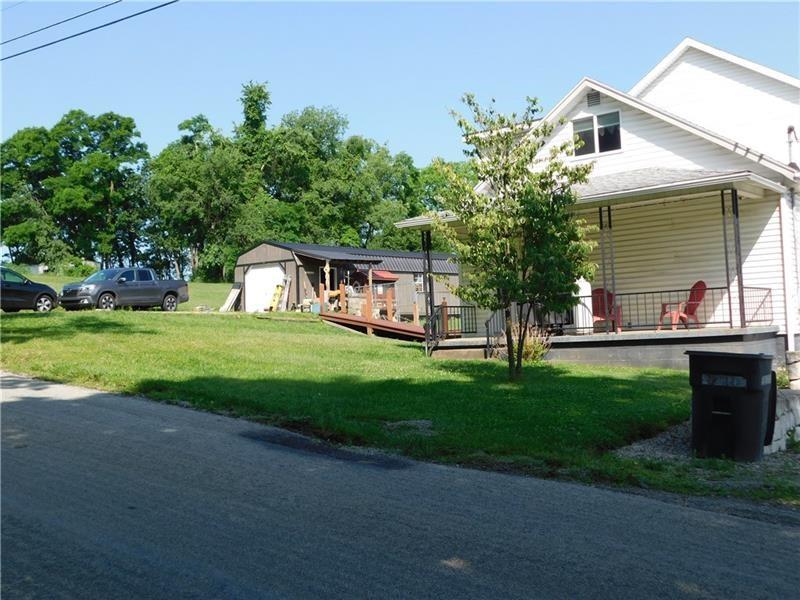 577 Woodside Old Frame Road Smithfield, PA 15478 - Photo 5 of 49 a front view of a house with garden