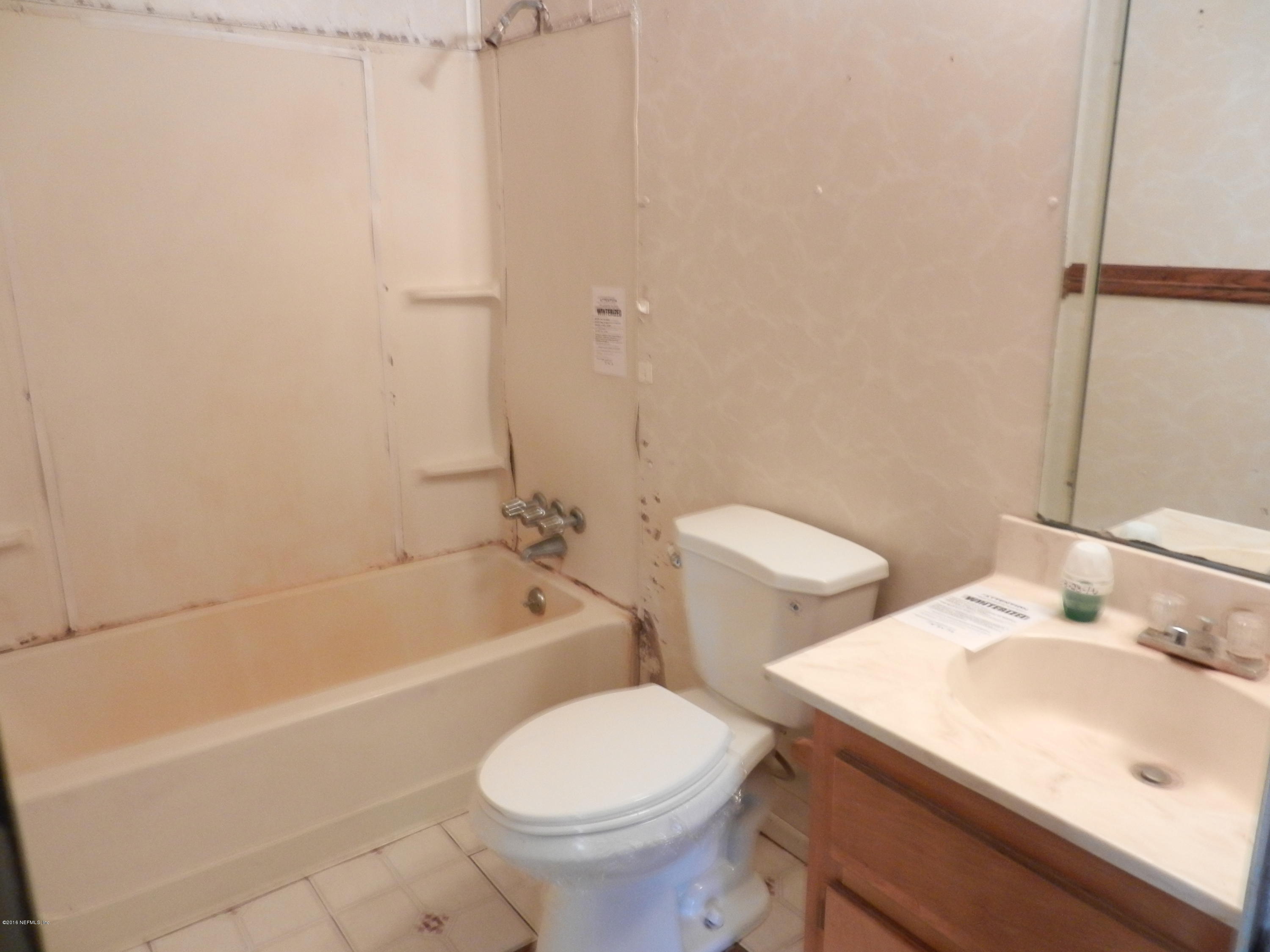 86232 Pages Dairy Road Yulee, FL 32097 - Photo 8 of 13 a bathroom with a sink toilet and bathtub