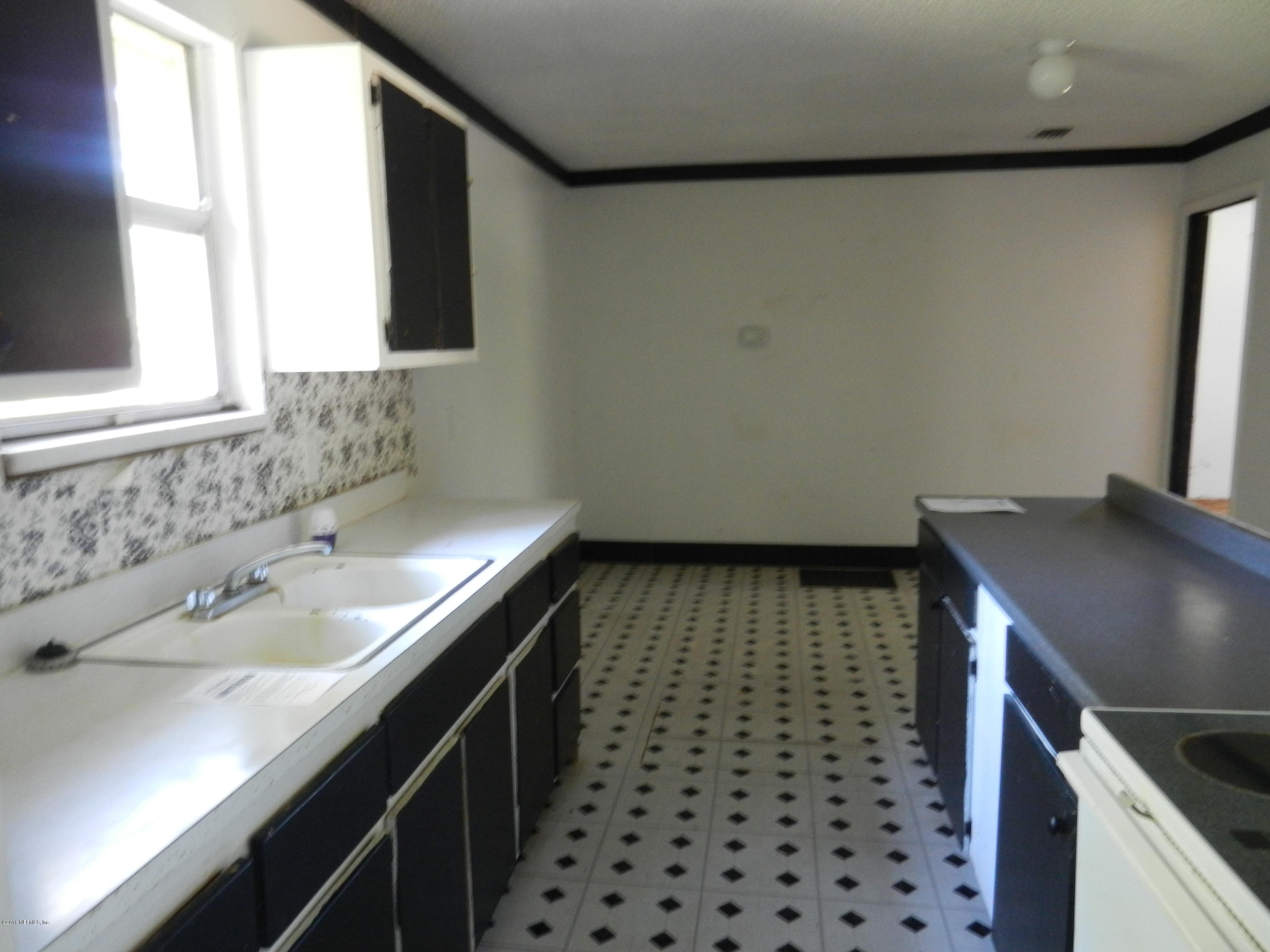 86232 Pages Dairy Road Yulee, FL 32097 - Photo 9 of 13 a bathroom with a sink a toilet and a mirror