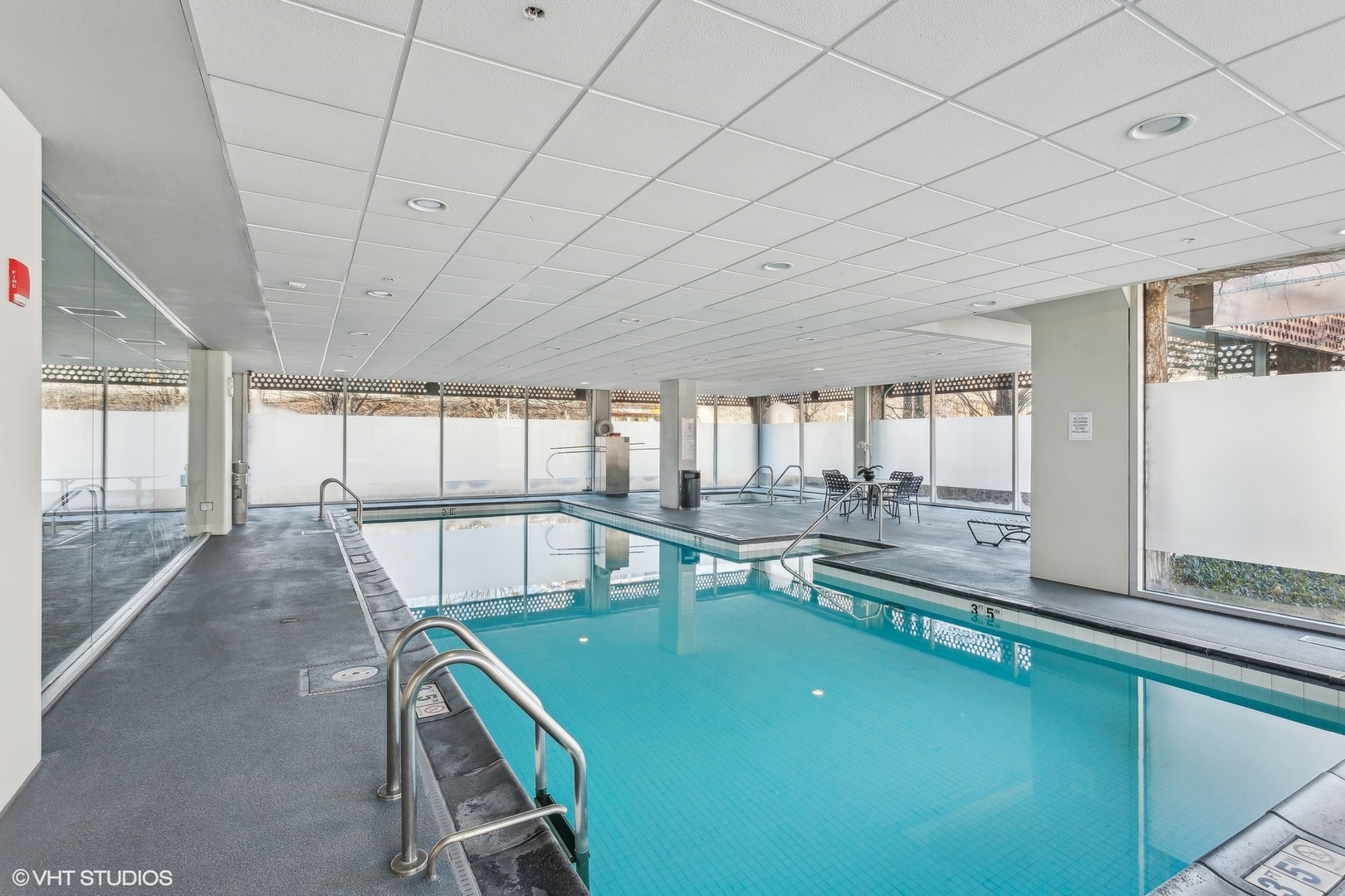 800 Elgin Road, Unit 511 Evanston, IL 60201 - Photo 27 of 29 a living room with a table and chairs