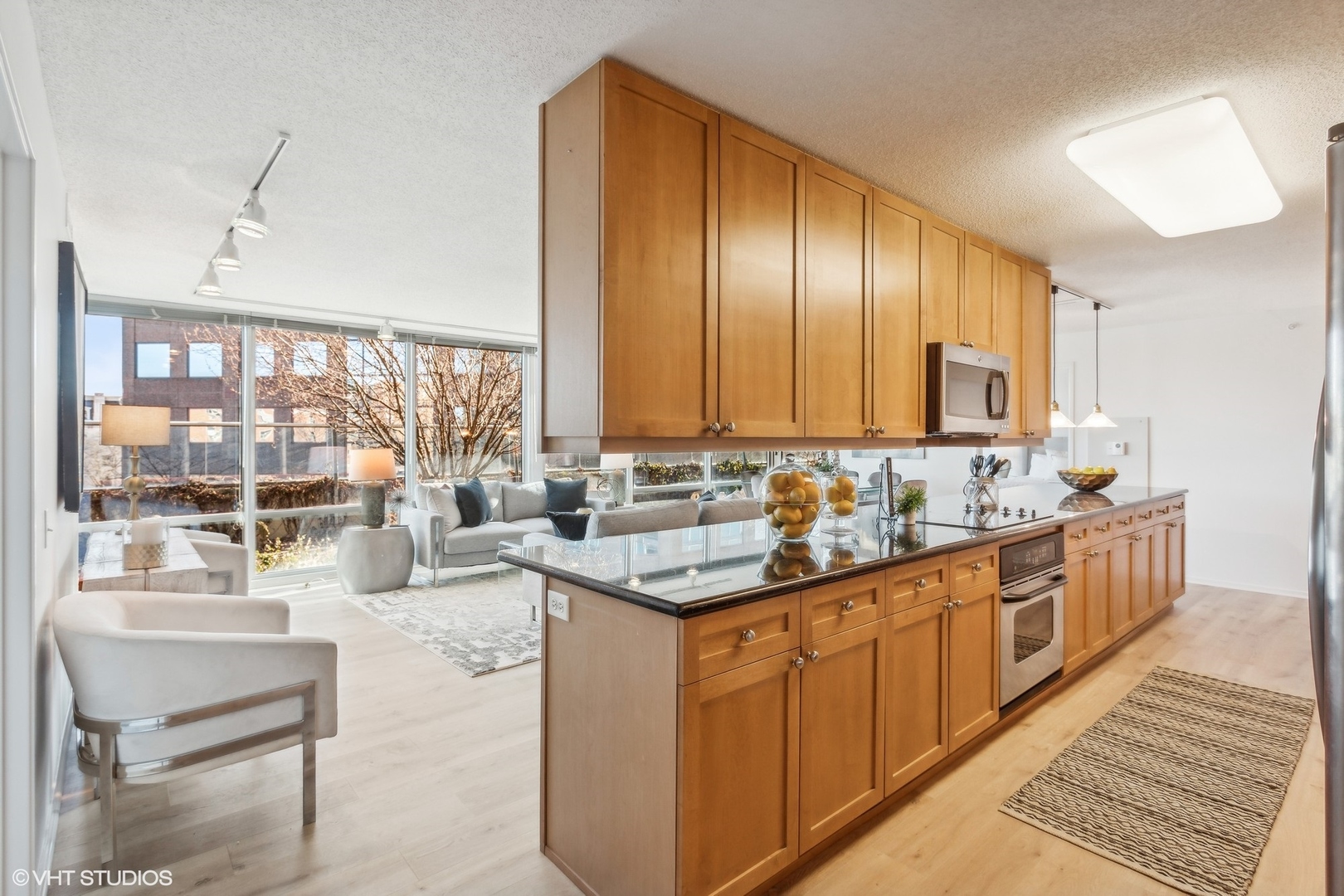 800 Elgin Road, Unit 511 Evanston, IL 60201 - Photo 4 of 29 a kitchen with stainless steel appliances granite countertop counter space a sink and cabinets