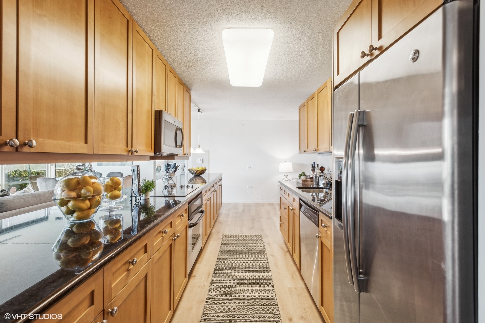 800 Elgin Road, Unit 511 Evanston, IL 60201 - Photo 5 of 29 a kitchen with stainless steel appliances a sink and cabinets