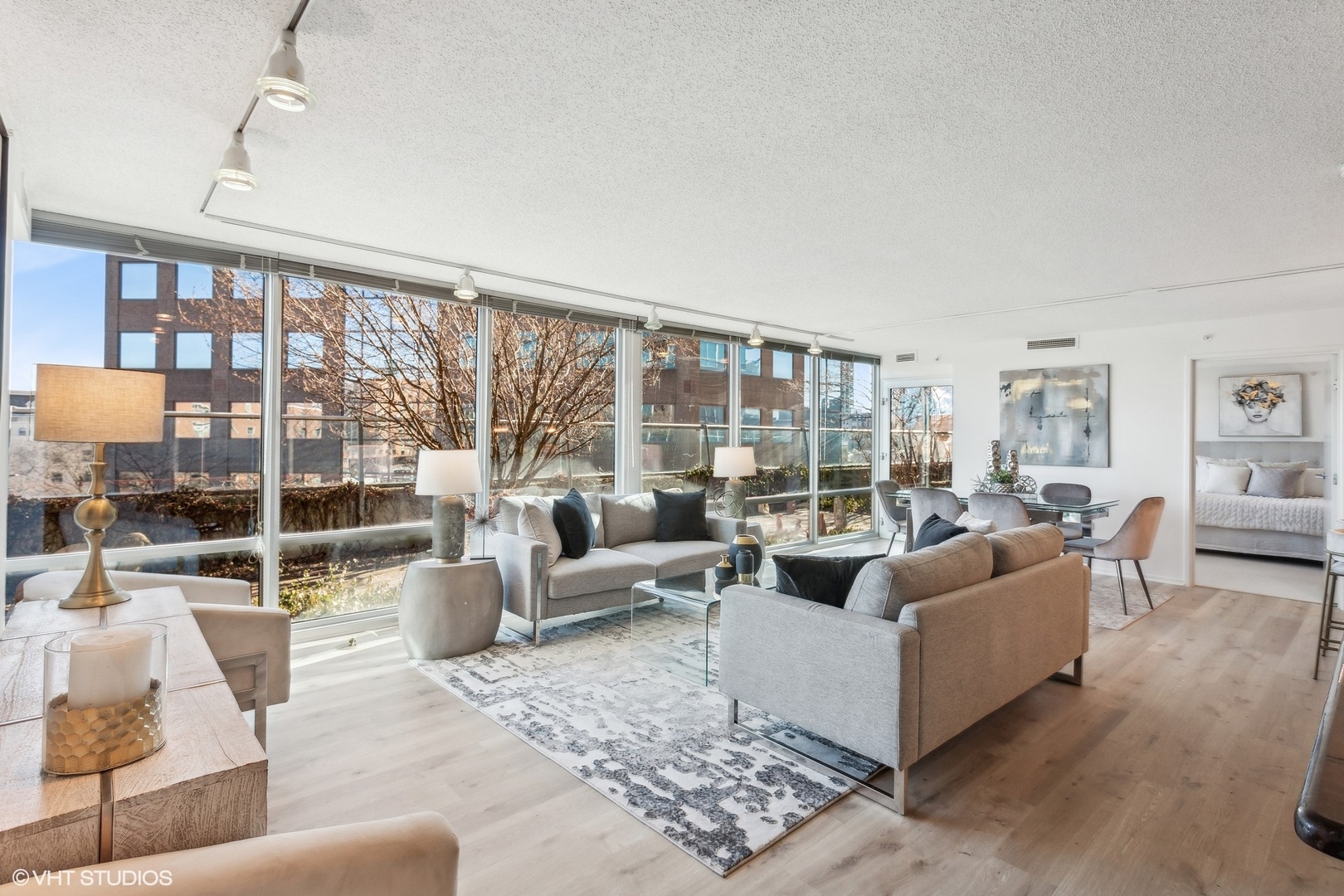 800 Elgin Road, Unit 511 Evanston, IL 60201 - Photo 7 of 29 a living room with furniture and a large window