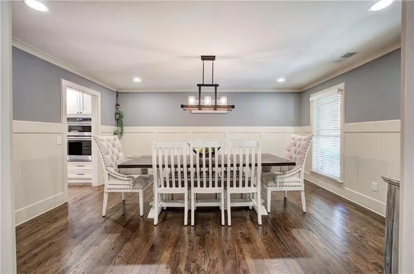 a living room with furniture a fireplace and a table