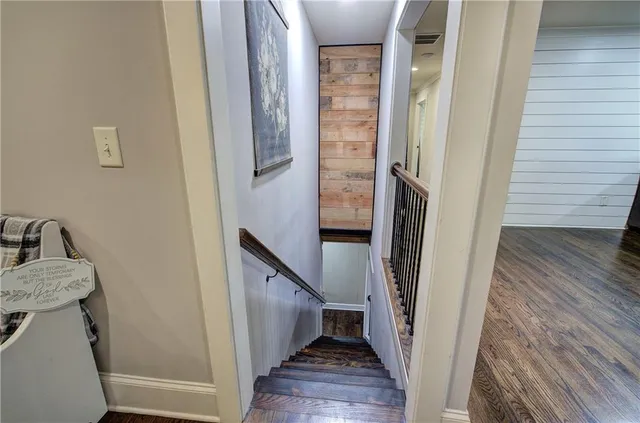 a kitchen with granite countertop a sink stainless steel appliances and cabinets