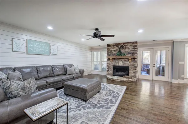 a kitchen with stainless steel appliances granite countertop a sink a stove and a refrigerator